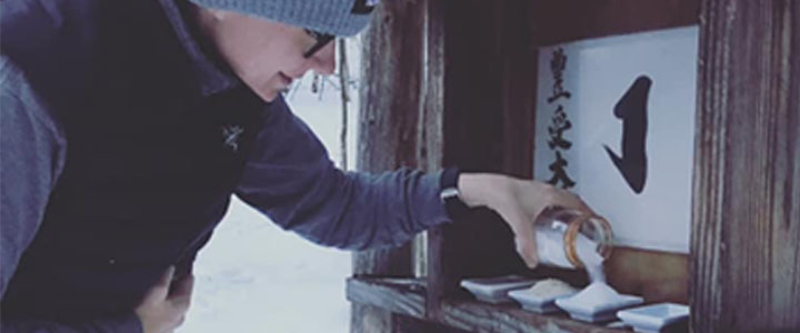 Alley Smith makes offerings at one of Karmê Chöling's Kami Shrines.